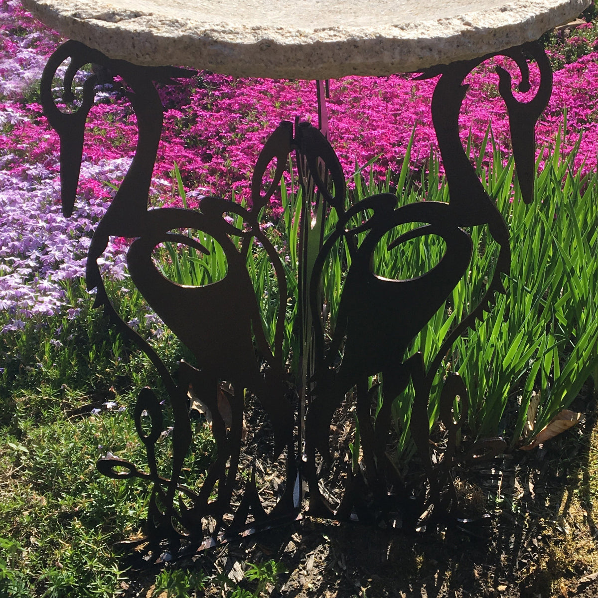 Crane laser cut birdbath base in garden setting with gold top