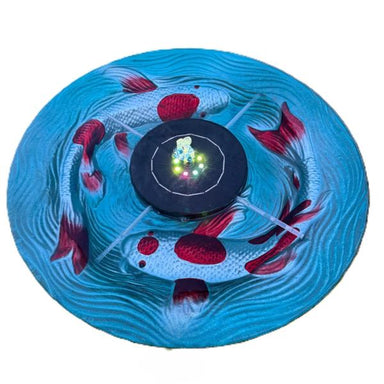Backyard Essentials floating solar bird bath bubbler spraying water in a blue bath