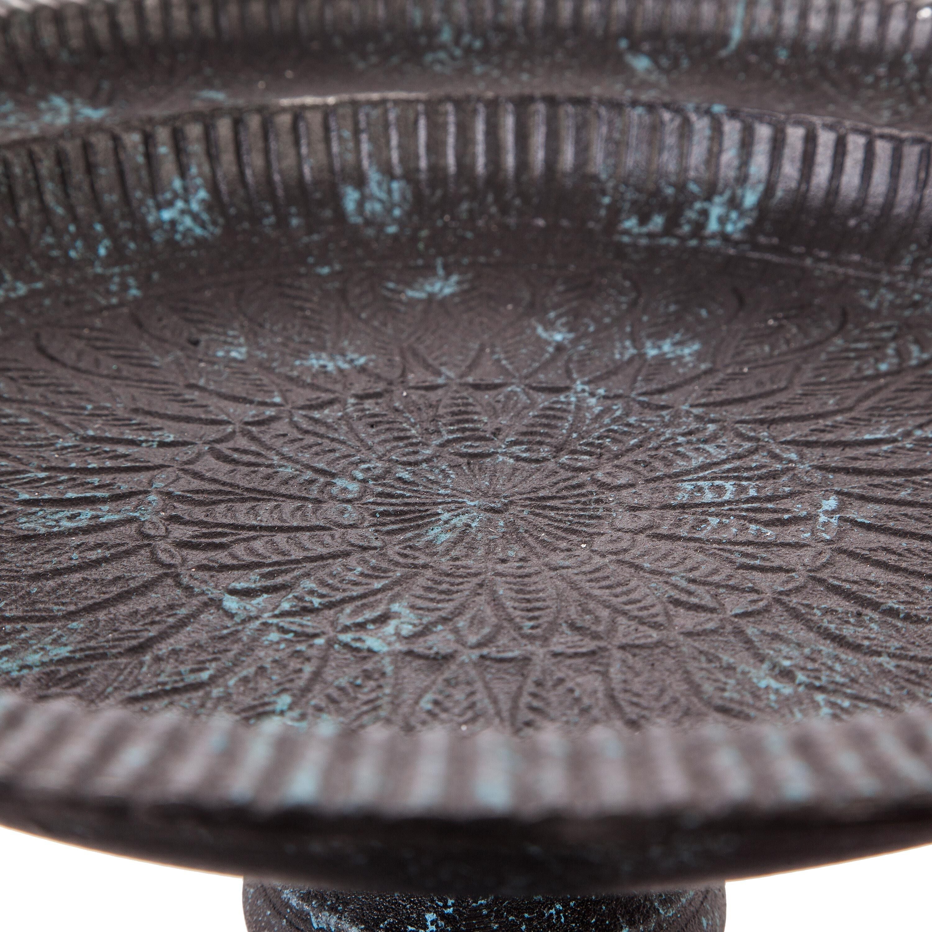 Detailed embossed pattern inside the cast aluminum birdbath basin