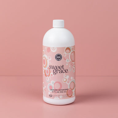 Sweet Grace 32oz Laundry Detergent bottle on pink background