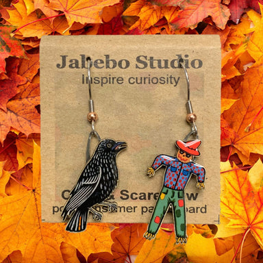 Jabebo Crow and Scarecrow dangle earrings on branded card, black crow and colorful scarecrow design